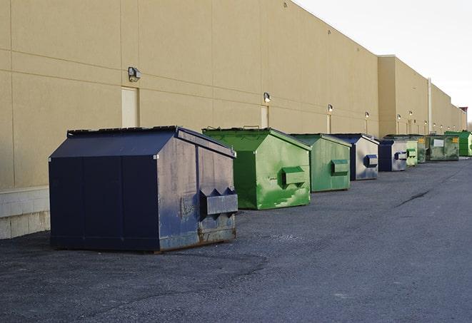 metal waste containers sit at a busy construction site in Anacoco LA